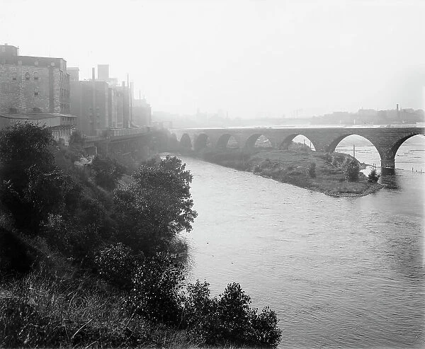 Minneapolis, view from across river, between 1880 and 1899. Creator: Unknown