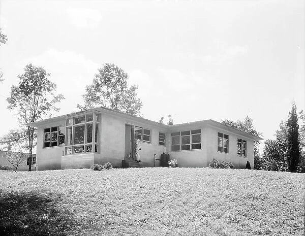 The model house nears completion, Hightstown, New Jersey, 1936. Creator: Dorothea Lange