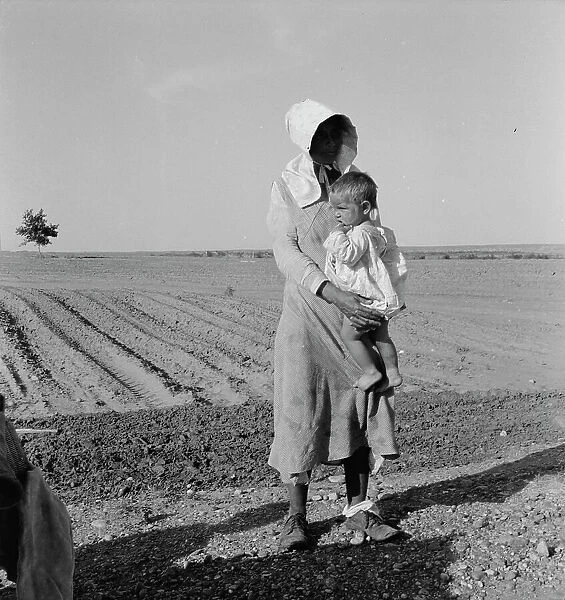 Mother and child of flood refugee family, near Memphis, Texas, 1937. Creator: Dorothea Lange