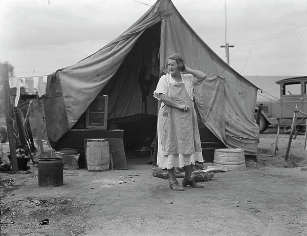 Mother of family of migrant fruit workers encamped on outskirts of Porterville, California, 1936. Creator: Dorothea Lange