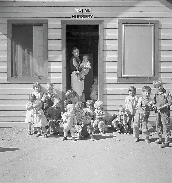 While the mothers are working in the fields, the preschool children... Kern migrant camp, 1936. Creator: Dorothea Lange