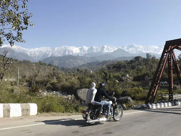 Motorcycle on road near Dhauladar Mountains Himachal Pradesh. Creator: Unknown