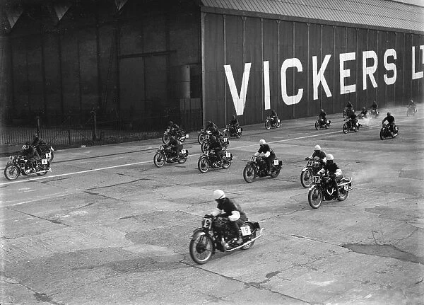Motorcycles racing at the MCC Members Meeting, Brooklands, 10 September 1938. Artist: Bill Brunell