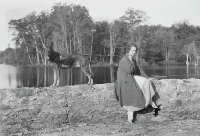 Framed Print : Mower, Margaret, Miss, with dog, seated outdoors, not before 1916. Creator: Arnold Genthe Framed Print : Mower, Margaret, Miss, with dog, seated outdoors, not before 1916. Creator: Arnold Genthe