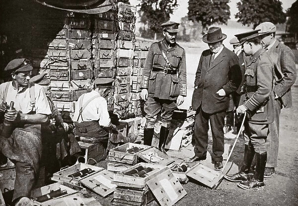 Mr Asquith watching men adjusting fuses, Somme campaign, France, World War I, 1916