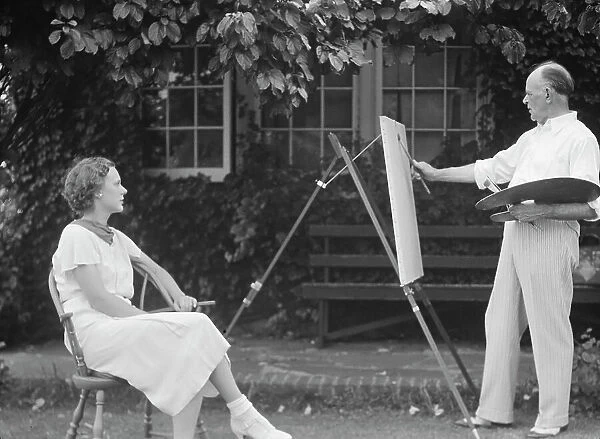 Mr. Hamilton King painting Mrs. Hamilton's portrait outdoors, between 1934 and 1942. Creator: Arnold Genthe