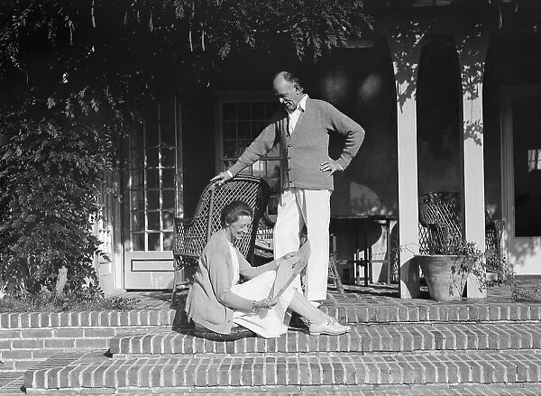Mr. and Mrs. Hamilton King seated on the steps of their house, between 1911 and 1934. Creator: Arnold Genthe