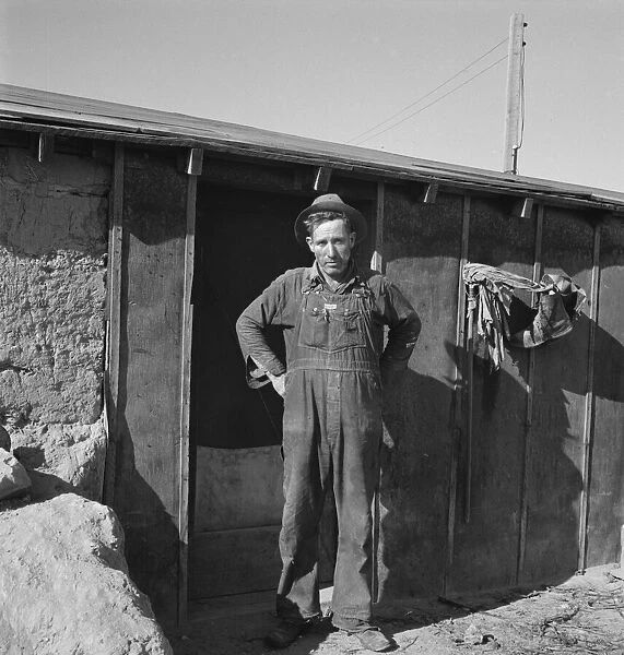 Mr. Roberts in front of his Owyhee project home, Malheur County, Oregon, 1939. Creator: Dorothea Lange