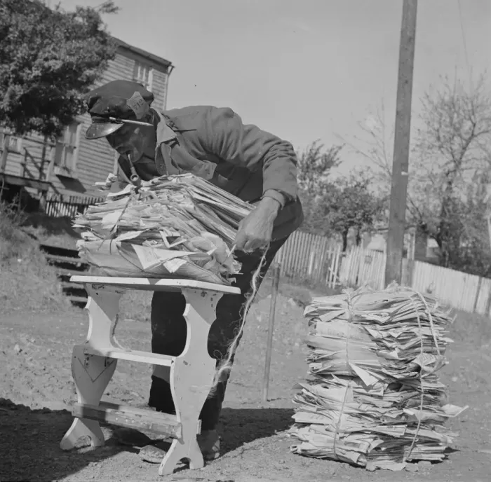 Framed Print : Mr. Venus Alsobrook, official salvage collector for the government wrapping... Washington, DC, 1942 Creator: Gordon Parks Framed Print : Mr. Venus Alsobrook, official salvage collector for the government wrapping... Washington, DC, 1942 Creator: Gordon Parks