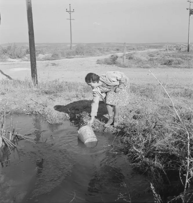 Framed Print : Mrs. Bartheloma dipping water from irrigation ditch... Nyssa Heights, Malheur County, Oregon, 1939. Creator: Dorothea Lange Framed Print : Mrs. Bartheloma dipping water from irrigation ditch... Nyssa Heights, Malheur County, Oregon, 1939. Creator: Dorothea Lange