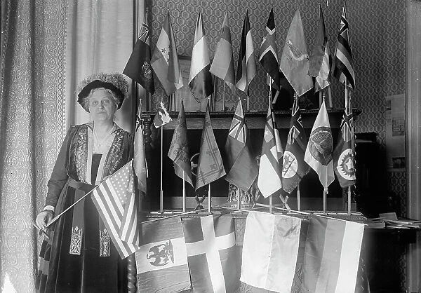 Mrs. Carrie Chapman Catt with Flags of 22 Nations, 1917. Creator: Harris & Ewing. Mrs. Carrie Chapman Catt with Flags of 22 Nations, 1917. Creator: Harris & Ewing