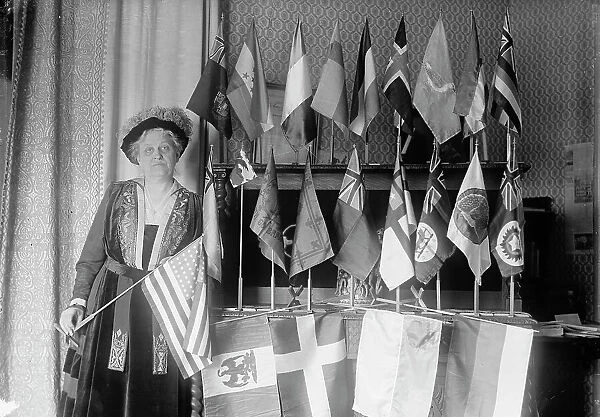 Mrs. Carrie Chapman Catt with Flags of 22 Nations, 1917. Creator: Harris & Ewing. Mrs. Carrie Chapman Catt with Flags of 22 Nations, 1917. Creator: Harris & Ewing