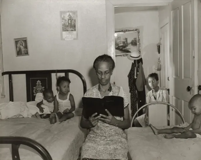 Framed Print : Mrs. Ella Watson, a government charwoman, reading the Bible to her household, Washington, DC, 1942. Creator: Gordon Parks