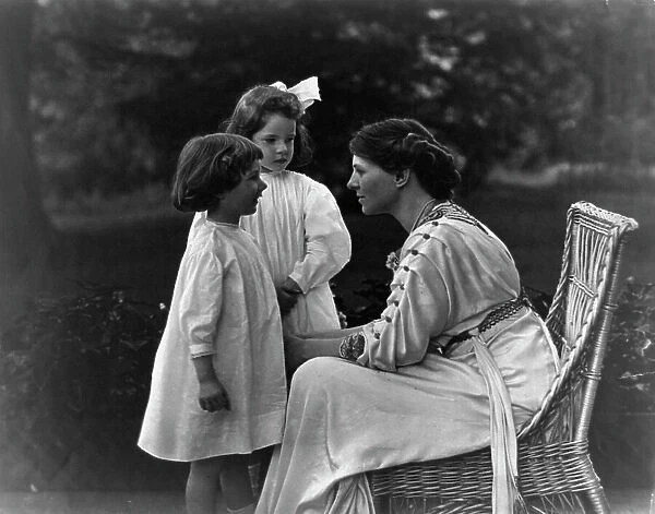 Mrs. Frank Vanderlip seated on porch, with two children, not after 1913. Creator: Frances Benjamin Johnston