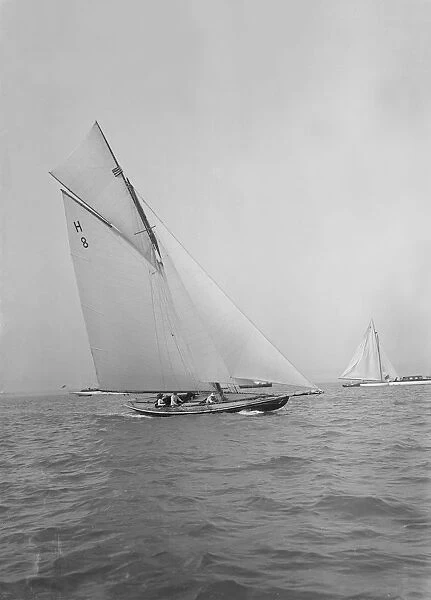 Mrs GA Shenley at the helm of the 8 Metre class Spero (H8). Creator: Kirk & Sons of Cowes