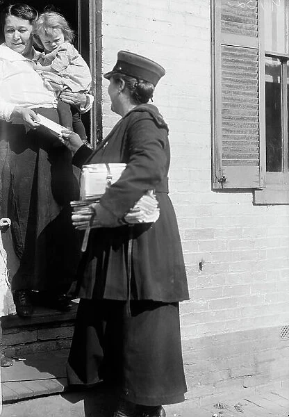 Mrs. Parmlee Campbell, Woman Mail Carrier - Delivering Mail... 1917 Creator: Harris & Ewing. Mrs. Parmlee Campbell, Woman Mail Carrier - Delivering Mail... 1917 Creator: Harris & Ewing