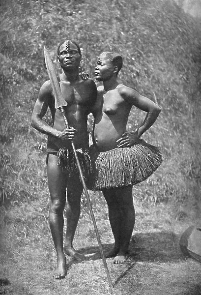 A Mulolo (Congo) warrior and his wife from the central Congo regions, 1902