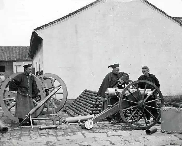 Framed Print : Nanking, Kiangsu province, China: three men examining a gun at the arsenal, 1871. Creator: John Thomson Framed Print : Nanking, Kiangsu province, China: three men examining a gun at the arsenal, 1871. Creator: John Thomson