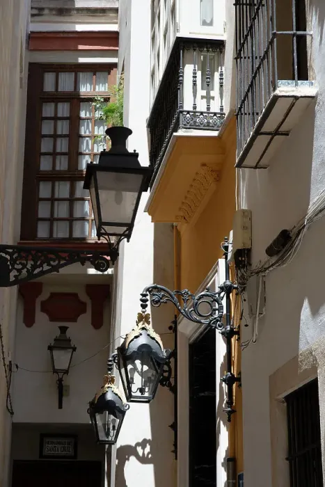 Framed Print : Narrow street with old lamps and balconies in the pedestrian area of Seville, Spain, 2023. Creator: Ethel Davies Framed Print : Narrow street with old lamps and balconies in the pedestrian area of Seville, Spain, 2023. Creator: Ethel Davies