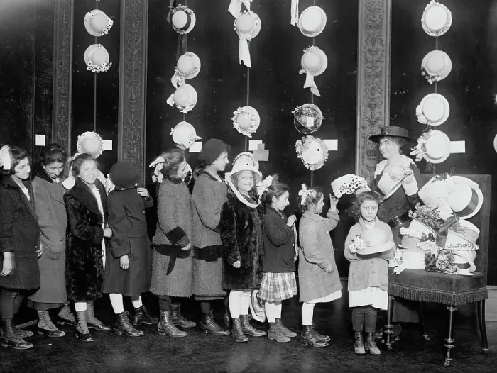 Framed Print : Natalie Stewart Distributing hats to poor children, between c1915 and c1920. Creator: Bain News Service Framed Print : Natalie Stewart Distributing hats to poor children, between c1915 and c1920. Creator: Bain News Service