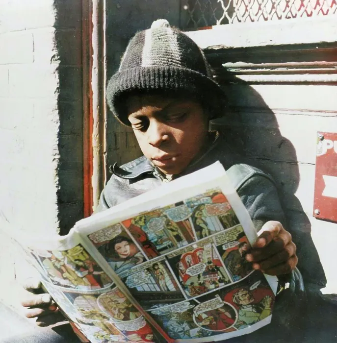 Framed Print : Negro youth reading a funny paper on a door step in the Southwest section, Washington, D.C. 1942. Creator: Gordon Parks Framed Print : Negro youth reading a funny paper on a door step in the Southwest section, Washington, D.C. 1942. Creator: Gordon Parks