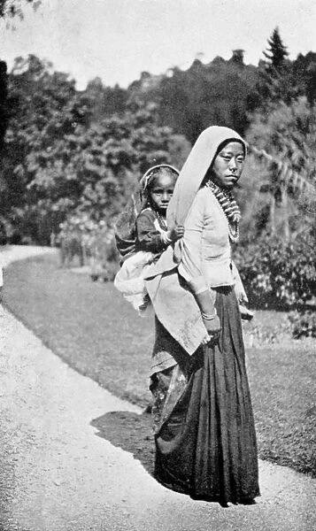 A Nepalese woman with her child, c1910