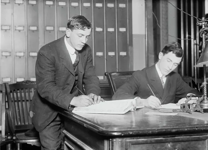 Framed Print : Two new citizens sign naturalizaton papers in judge's chambers, 1910. Creator: Bain News Service Framed Print : Two new citizens sign naturalizaton papers in judge's chambers, 1910. Creator: Bain News Service