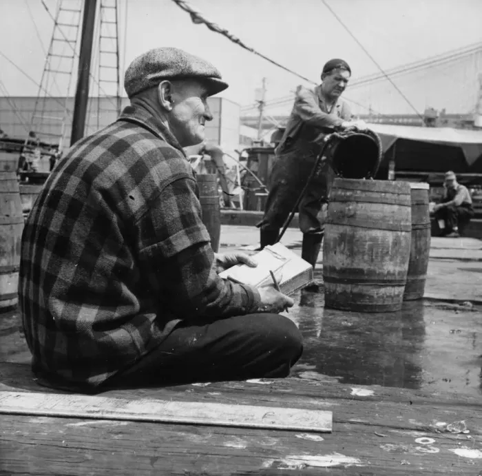 Framed Print : New England fisherman checking baskets of fish as they are lifted from his ship, New York, 1943. Creator: Gordon Parks Framed Print : New England fisherman checking baskets of fish as they are lifted from his ship, New York, 1943. Creator: Gordon Parks