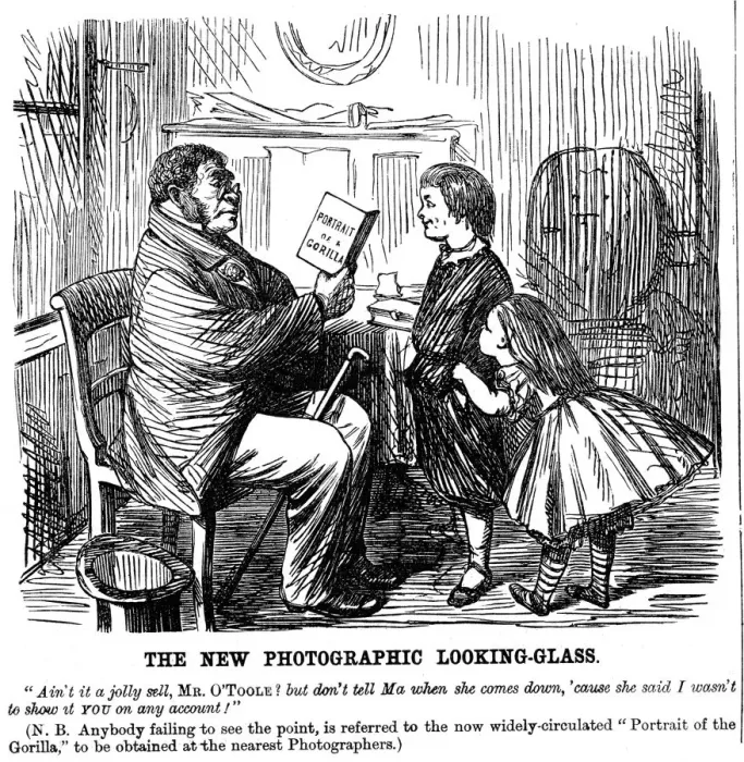 Framed Print : The New Photographic Looking Glass, cartoon from Punch, everyday proof of mans origins, 1861 Framed Print : The New Photographic Looking Glass, cartoon from Punch, everyday proof of mans origins, 1861