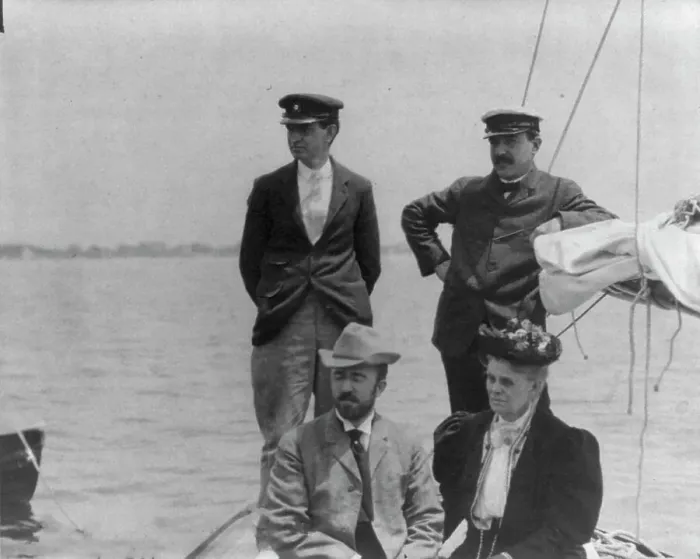 Framed Print : New York Yacht Club, Oyster Bay, L.I. 1905: 2 men with man and woman watching yacht race, 1905. Creator: Frances Benjamin Johnston Framed Print : New York Yacht Club, Oyster Bay, L.I. 1905: 2 men with man and woman watching yacht race, 1905. Creator: Frances Benjamin Johnston