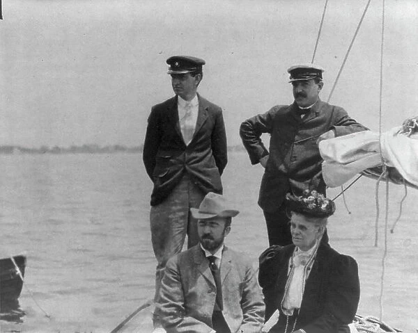 New York Yacht Club, Oyster Bay, L.I. 1905: 2 men with man and woman watching yacht race, 1905. Creator: Frances Benjamin Johnston