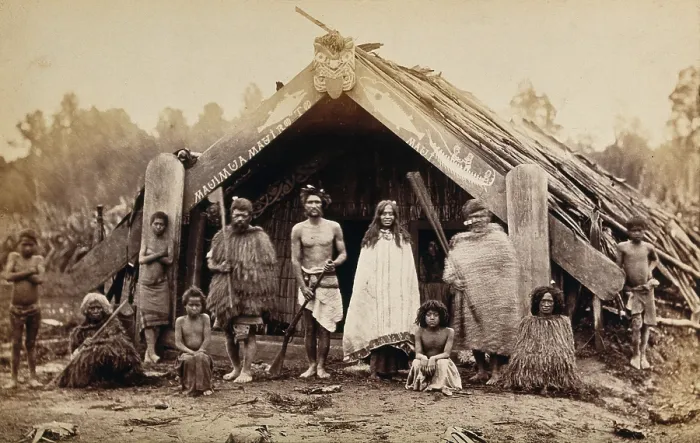 Framed Print : New Zealand: a group of Maori in front of a traditional building, 19th century. Creator: Unknown Framed Print : New Zealand: a group of Maori in front of a traditional building, 19th century. Creator: Unknown