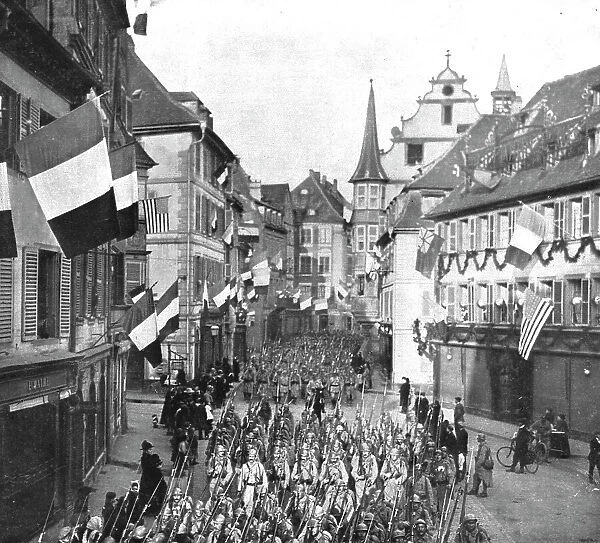 Notre entrée a Colmar; Le defile des troupes francaises dans les rues...22 novembre 1918. Creator: Unknown