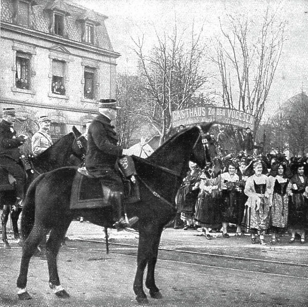 Notre entrée a Colmar; Le general de Castelnau devant les drapeaux de la 169e division... 1918. Creator: Unknown