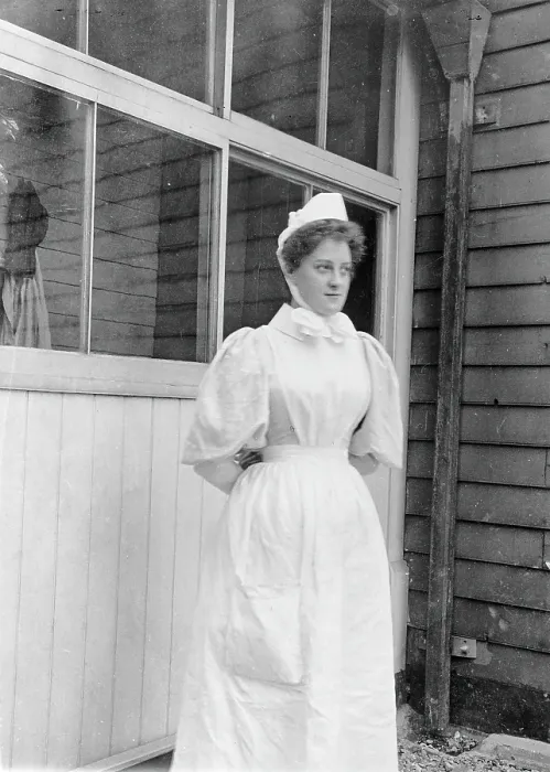 Framed Print : Nurse standing outside an isolation hospital, possibly at Ilford, Essex. Creator: Unknown Framed Print : Nurse standing outside an isolation hospital, possibly at Ilford, Essex. Creator: Unknown