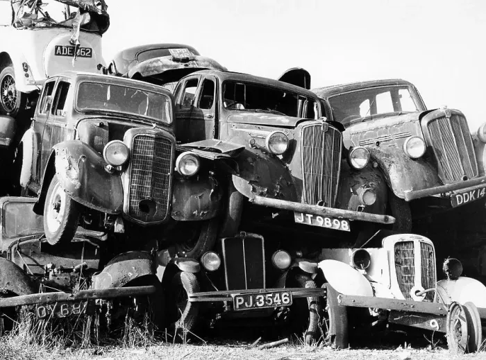 Framed Print : Old cars piled up in a scrapyard, Britain Framed Print : Old cars piled up in a scrapyard, Britain