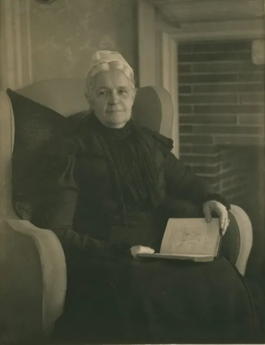 Framed Print : Old woman in an armchair, with an open book in her lap, c1900. Creator: Mathilde Weil Framed Print : Old woman in an armchair, with an open book in her lap, c1900. Creator: Mathilde Weil