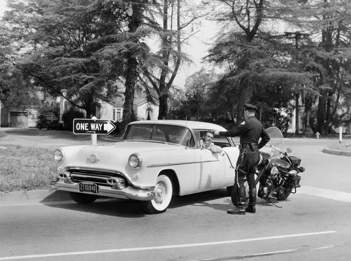 Framed Print : An Oldsmobile at the corner of an American street, 1954
