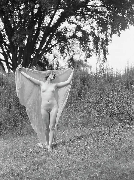 Olson, Margaret, Miss, standing outdoors, 1924 July. Creator: Arnold Genthe