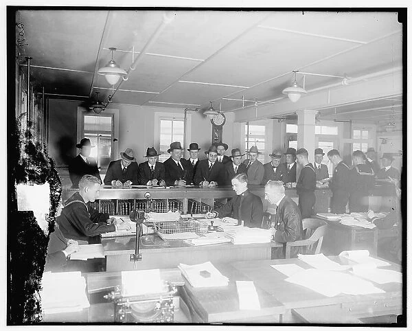 Opening of bids, Navy Dept. Bureau of Accts, between 1910 and 1920. Creator: Harris & Ewing. Opening of bids, Navy Dept. Bureau of Accts, between 1910 and 1920. Creator: Harris & Ewing