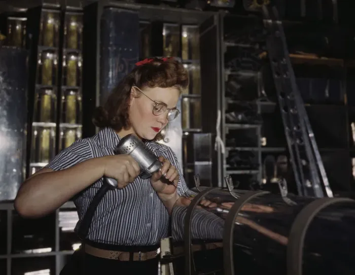 Framed Print : Operating a hand drill at the North American Aviation, Inc. a woman is in the control... 1942. Creator: Alfred T Palmer Framed Print : Operating a hand drill at the North American Aviation, Inc. a woman is in the control... 1942. Creator: Alfred T Palmer