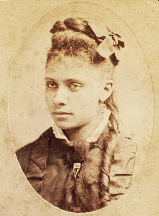 Framed Print : Oval portrait of unidentified young woman with long curl draped over chest. c1880-c1889. Creator: Unknown Framed Print : Oval portrait of unidentified young woman with long curl draped over chest. c1880-c1889. Creator: Unknown