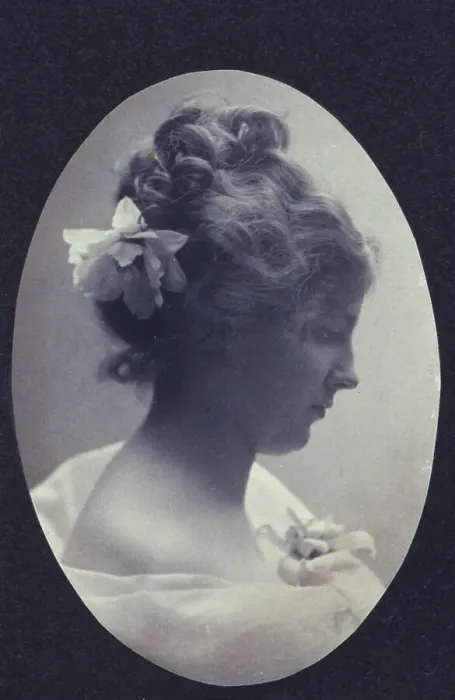 Framed Print : Oval portrait of woman with a flower in her hair and a corsage on her dress, c1900. Creator: Fannie L. Elton Framed Print : Oval portrait of woman with a flower in her hair and a corsage on her dress, c1900. Creator: Fannie L. Elton
