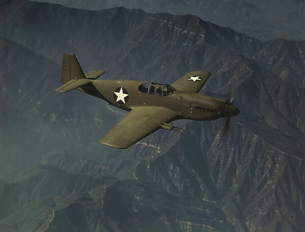 P-51 'Mustang'fighter in flight, Inglewood, Calif. 1942. Creator: Alfred T Palmer
