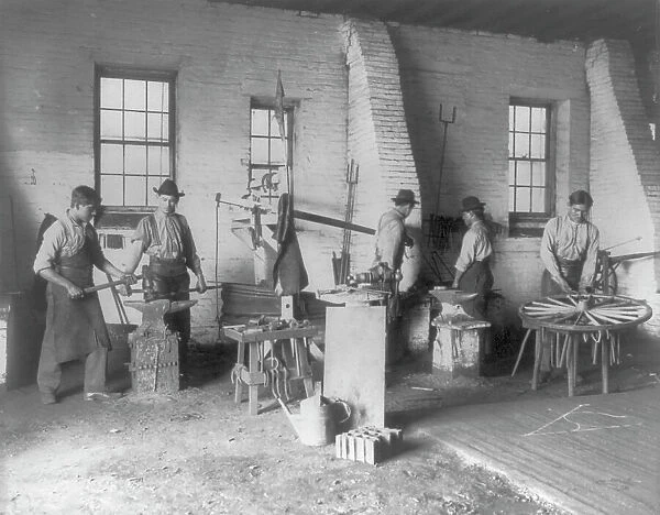 Pa. - Carlisle Indian School - student wheelwrights working in shop, 1901. Creator: Frances Benjamin Johnston