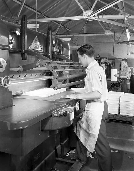 Page cutting guillotine in use at a South Yorkshire printing company, 1959. Artist