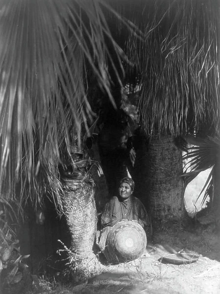 Under the palms-Cahuilla, 1905, c1924. Creator: Edward Sheriff Curtis
