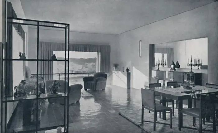 Framed Print : Paniconi and Pediconi. A dining room with a large window and curtains designed to