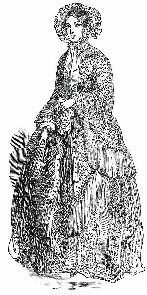 Paris Fashions for June - Promenade Dress, 1850. Creator: Unknown