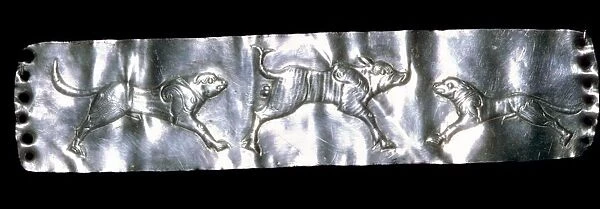 Parthian silver plaque of two dogs and a boar